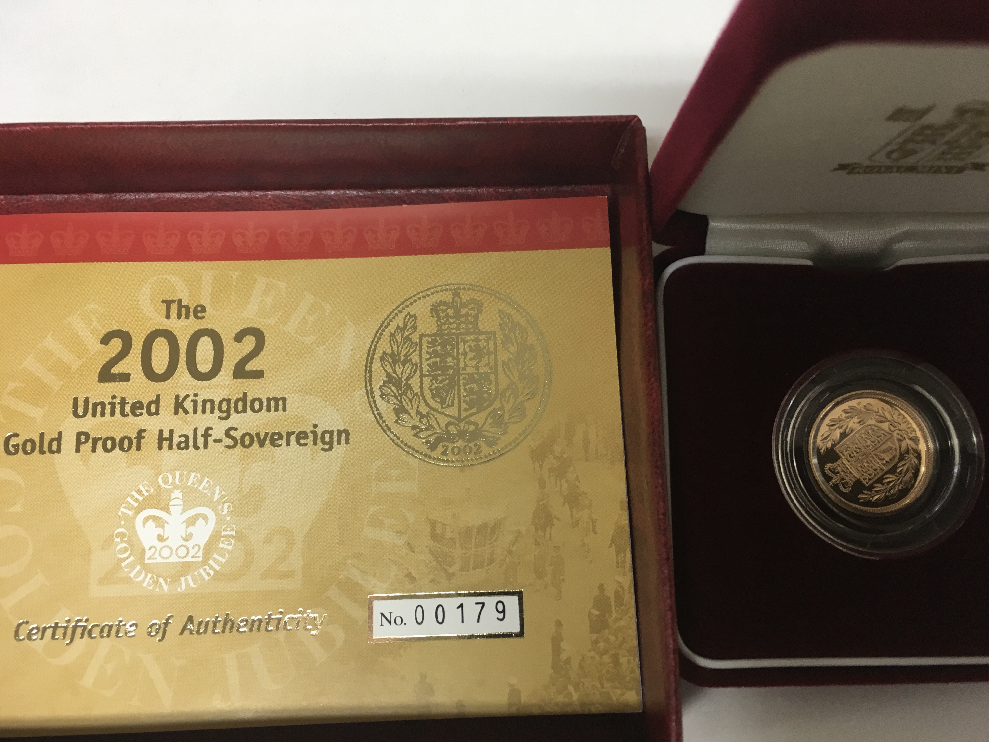 A 2002 gold proof half sovereign in celebration of