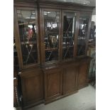 An Georgian style mahogany break front bookcase wi