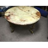 An oriental gilt metal circular table with onyx to