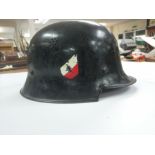 A similar WW2 German helmet paiktsd black with an