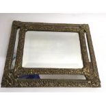 A gilt mounted mirror.Approx 26x33cm