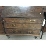 A George III mahogany bureau with fitted interior