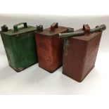 Three vintage petrol cans.