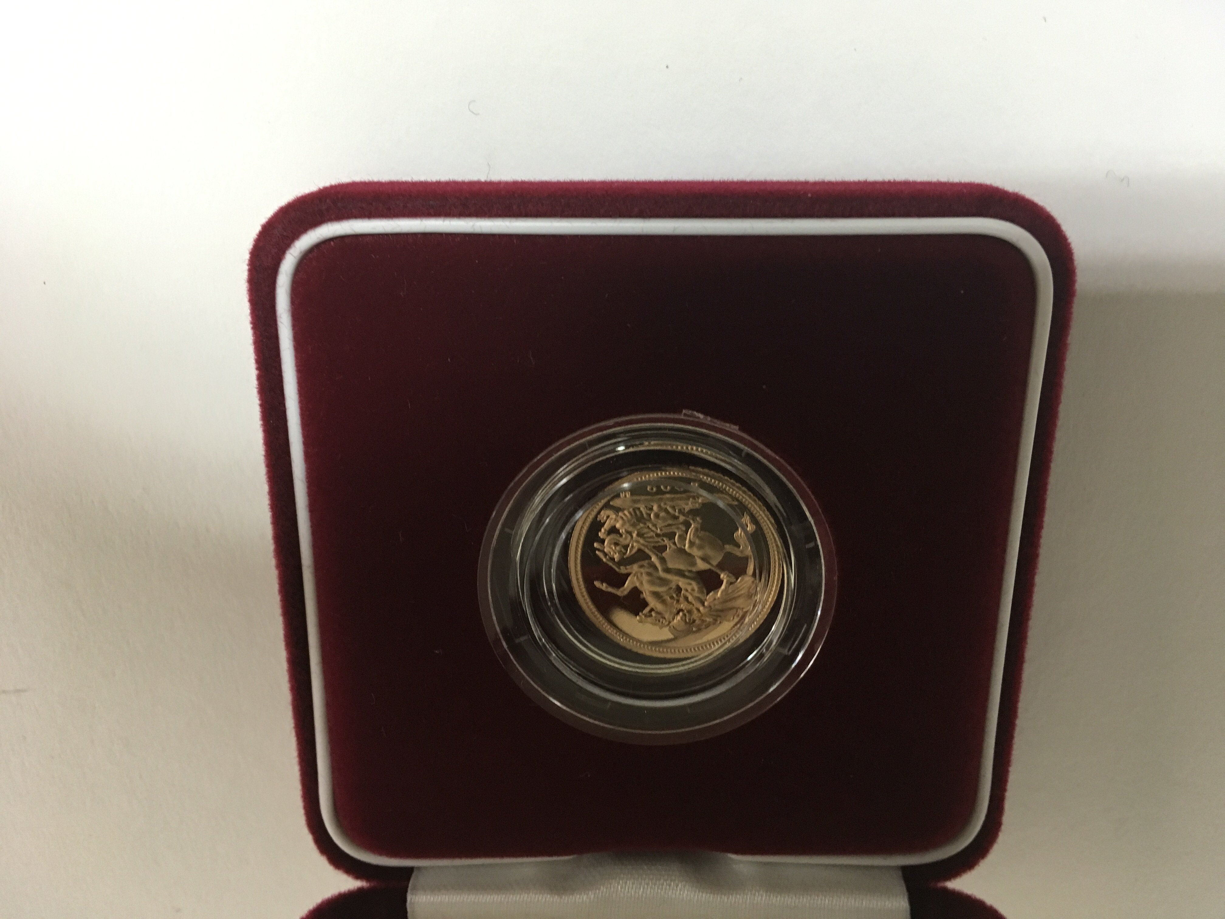 A gold proof half sovereign in a fitted box within