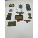 A collection of German and Italian WW2 badges