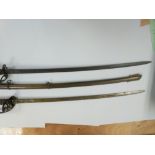 Two British cavalry swords, one with a metal scabb