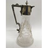 A silver plated claret jug with etched leaf decora