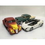 Three die cast models of cars by Ertl, Universal H