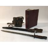 A WW1 bayonet, pair of binoculars and a 1934 Post