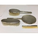 A silver four piece dressing table set, Birmingham