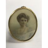 An oval portrait of a young lady painted on ivory.