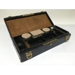 A leather cased travelling set with four Cartier s