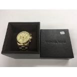 A boxed Michael Kors ladies chronograph watch.