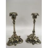 A pair of silver plated candlesticks, the open bas