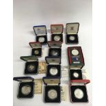 Twelve largely silver, cased proof coins