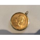 A 1967 Gold Sovereign in a pendent mount, total we