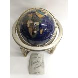 A gem set globe with original box and guarantee.Ap