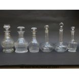 Six various clear cut glass decanters including a Scottish thistle decanter,