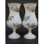 A pair of 19thC white glass vases with hand painted decoration of flowers and gilt banding, 25.