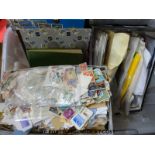 A large quantity of loose stamps and sundry albums of all-world stamps