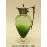 A green glass claret jug with silver plated mounts, 26cm tall.