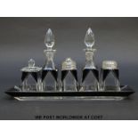 An Art Deco style glass condiment set comprising, two oil bottles and a mustard pot,