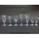 Seven Georgian and similar drinking and firing glasses some with knopped stems and some with cut