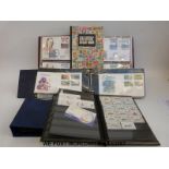 Three albums of St Vincent first day covers and a stockbook of mainly St Vincent QEII stamps