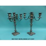 A pair of five branch silver plated candelabra,