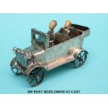 Chinese white metal model of a car with ivory headed driver and passenger and glass light, length 8.