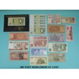 A collection of world and UK bank notes including Central Bank of Egypt, Italy, Singapore,