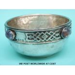 An Arts and Crafts George V hallmarked silver bowl with amethyst cabochon stones and hammered