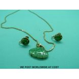 A 14ct gold necklace set with jadeite together with matching earrings