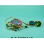 A yellow metal brooch set with an opal doublet and a pair of 9ct gold earrings set with synthetic