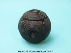 A carved spherical lignum vitae snuff box with push out container with threaded lid