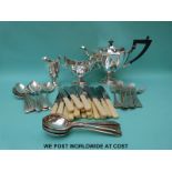 A plated pedestal tea set and a six place setting canteen of cutlery,