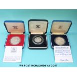 Two silver proof Royal commemorative cased crowns together with a Bank of Zambia 20 Ngwee