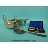 Three silver plated sauce boats together with a cased sewing set, hair pin pot etc.