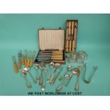 A quantity of cased and loose plated cutlery and plated napkin rings