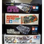 Four Tamiya model Le Mans car kits, Porsche 956, Sauber-Mercedes C9, Mazda 787B and Jaguar XJR-9LM,