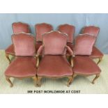 Seven (6+1) 19th/20th century upholstered mahogany dining chairs raised on cabriole legs.