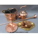 A hammered copper scuttle, copper kettle, carved novelty cigarette dispenser,