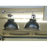 A pair of industrial hanging lights