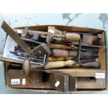 A quantity of vintage woodworking tools, including chisels, planes etc.