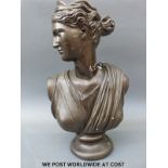 A bronzed bust of a classical maiden