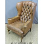 A leather Chesterfield wingback armchair