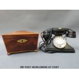 A vintage telephone - rewired for the modern home and an early 19th century tea caddy with lining