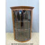 A small astragal glazed corner cupboard,