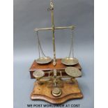 A set of travelling balance scales together with a set of Mordan & Co postage scales