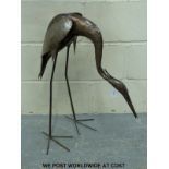 A garden sculpture of a heron in the manner of Walenty Pytel but not marked,